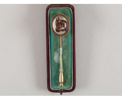 Gold & crystal stick pin mounted with a print of a racehorse's head,unmarked, in original retailer's case for Hall & Co., Man