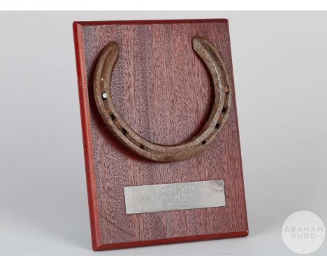 Shoe worn by the racehorse Soviet Star,mounted on a wooden plaque with easel support and set with an engraved metal plaque, 2