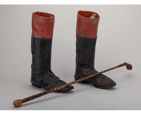 A pair of riding boots and a race whip originally used by the jockey Frankie Durr,the boots in black & tan leather, inscribed