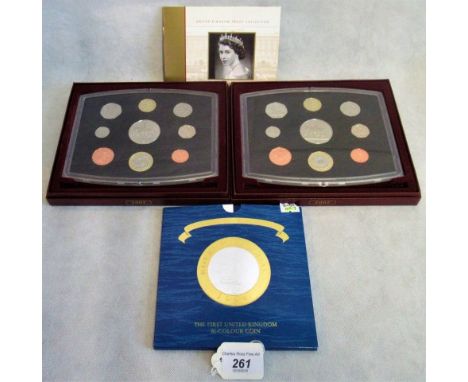 Two boxed sets of 2002 uncirculated coin collections, together with a wallet containing the First United Kingdom bi-colour co