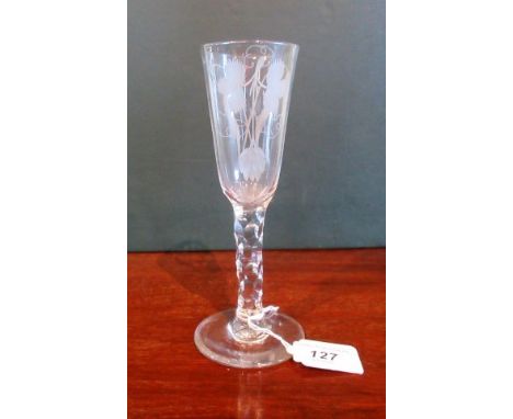 A 19th century drinking glass, with etched bowl decoration, diamond cut stem on circular base, 18cm tall.