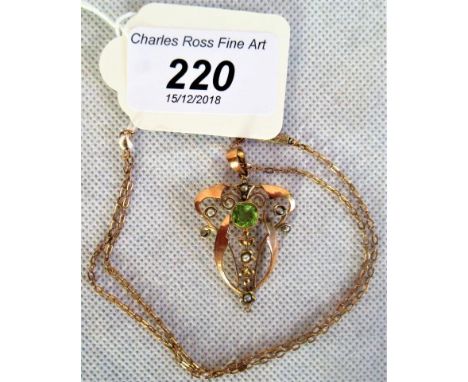 An Edwardian pendant and seed pearl negligee pendant and chain, of swirl and drop openwork design.