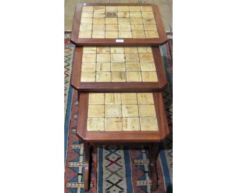 A nest of three mid-20th century tables, with tile effect inserts.