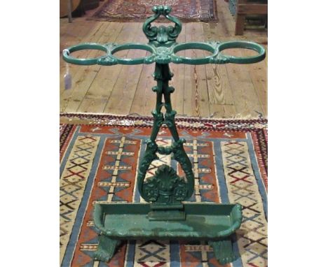An early 20th century green painted cast iron umbrella and stick stand in the Coalbrookdale style.