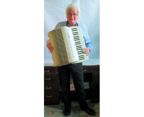 A cased Settimio Soprani piano accordion.