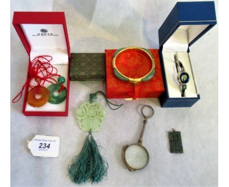 A carved jaded pendant bangle, three further pendants, a lady's cocktail watch and a pince nez.