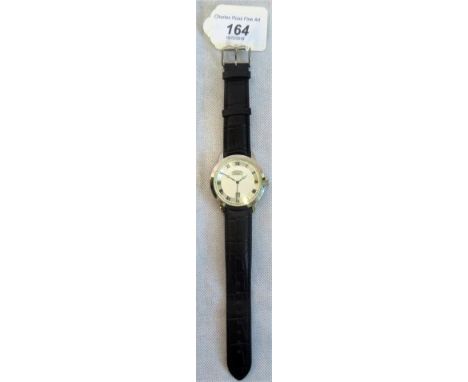 A Rotary gents wristwatch, the circular silver dial with chapter ring and engine turned centre decoration, with Roman numeral
