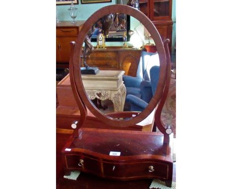 An Edwardian mahogany and string inlaid swing toilet mirror, with single drawer on ogee bracket feet.