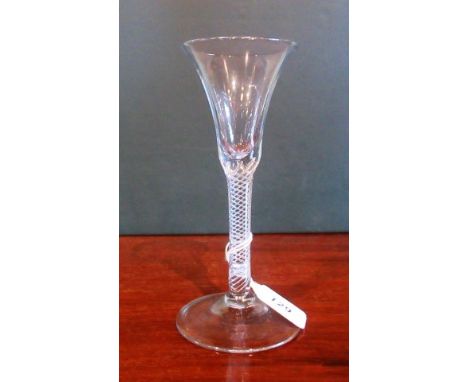 A 19th century drinking glass,with fluted bowl, double helix stem on conical base, 18cm tall.