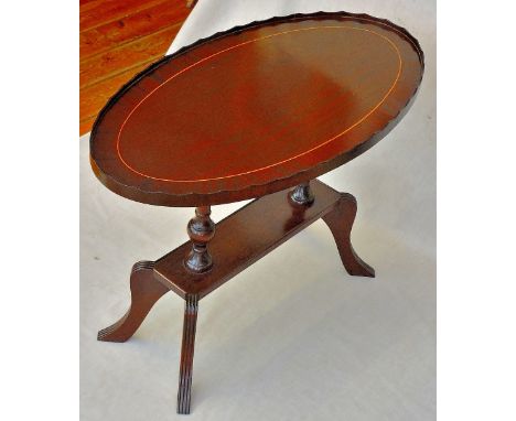 Coffee Table-A small, oval table measuring 29.1/2"long x 16" wide x 20"high, modern but in the Georgian style, it has a venee