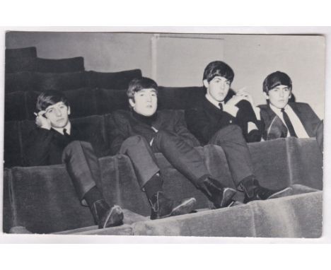 The Beatles-A postcard sized 3.1/2"x5.1/2", photograph of the group very early in their careers, The reverse has several line