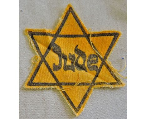 A 1930's - 40's 'Jude' Star of David, a Historically Rare item as these were given to people of the Jewish faith for identify