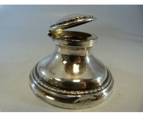 Hallmarked silver inkwell with hallmarked lid and oak bottom. Hallmarks for Birmingham.