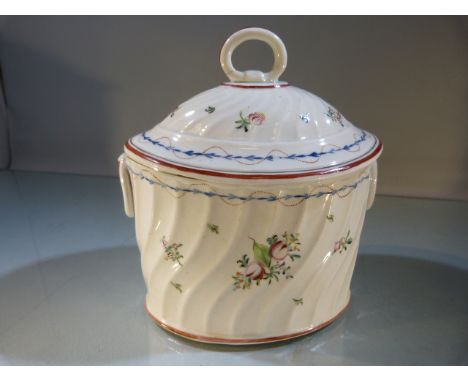 Staffordshire Tea caddy of oval form in Pratt colours. Loop handle to lid with fixed loop handles to sides. Decorated delicat