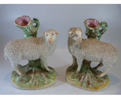 Staffordshire spill early vases - depicting sheep upon a rock. Decorated using pottery chips and enamel base colours. both ap