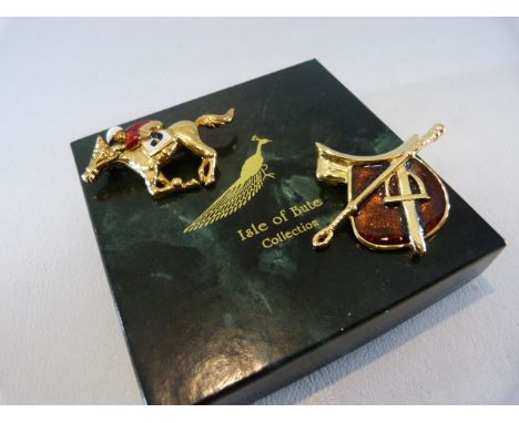 Two Gold coloured racing brooches with enamel.