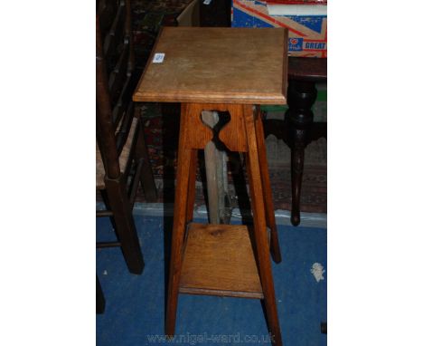 An art nouveau Oak Planter/Pot stand, moulded edge square top, the frieze having fret cut stylised tulip motifs, on splayed s
