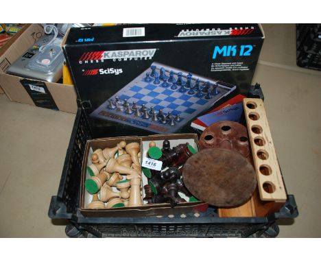 An Electronic Chess Set, chess pieces, pipe stands, etc.