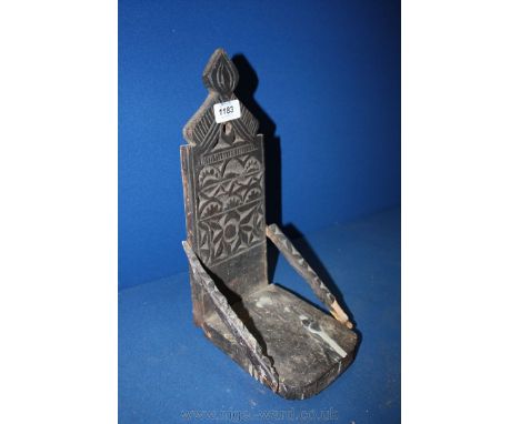 A carved folk art Candle Bracket, 34 cm x 16 cm