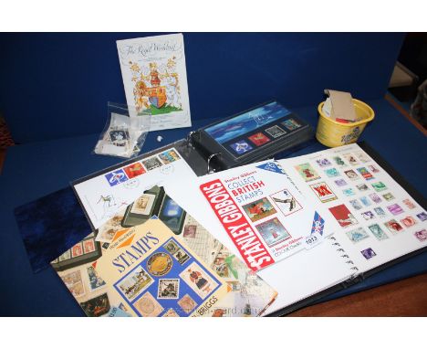 A quantity of loose Stamps, an Album collector's Book and an Album of first day covers