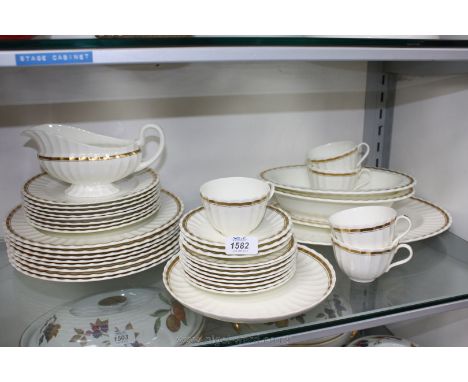 A Royal Worcester 'Elegance' Dinner Service, white ground with gilt trim, comprising eight Dinner, eight Side and eight Tea P
