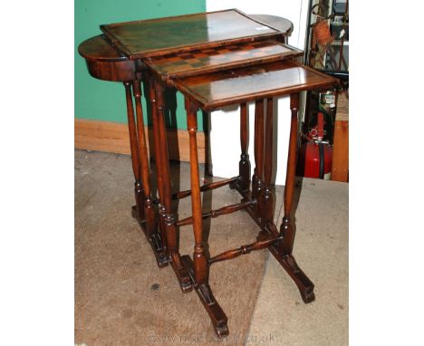A fine quality, possibly French Walnut Nest of three Occasional Tables, the largest having well-figured Walnut top with centr