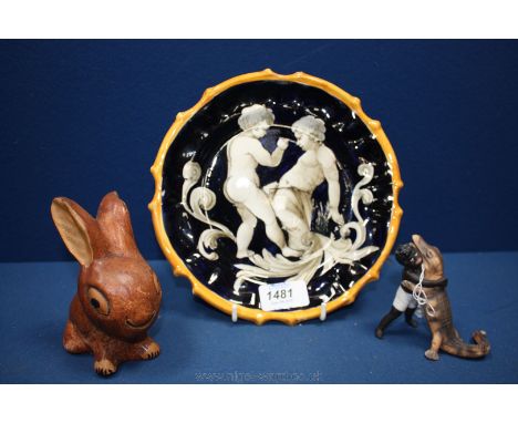 A bisque Negro Boy with crocodile, a/f, Cherub plate and old ceramic Bunny figure