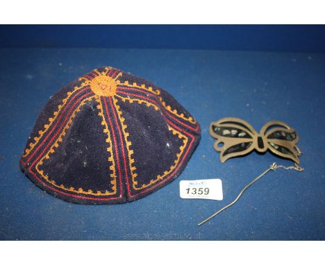 A Brass and mother of pearl decorated Butterfly hair decoration and a Skull Cap
