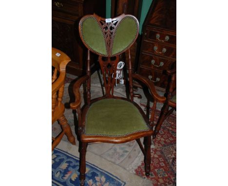 A good art nouveau Salon Elbow Chair with heart shaped pad back over ornate splat, standing on turned legs