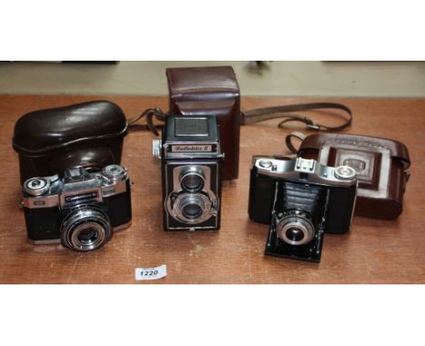 Three collectable Cameras: A Welta Reflekta II Twin Lens Reflex 120 roll Camera with a Meritar 75mm f/3.5 lens and original c