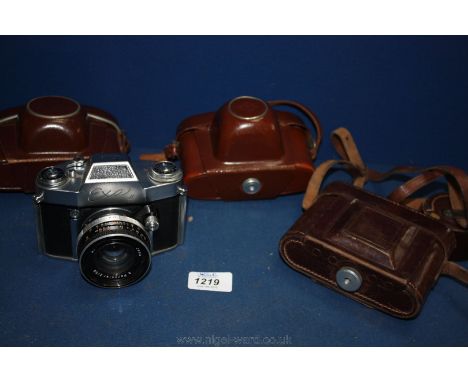 Four collectable Cameras: A Zeiss Ikon folding bellows 120 roll film Camera with a Carl Zeiss Jena Tessar 7.5cm f/3.5 lens, o