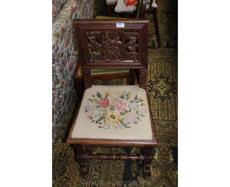 A 19th c. Oak Baronial style Dining/Hall Chair having square form back with fret cut pierced floral carved panel, on carved s