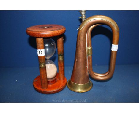 A large wooden Egg Timer and a military Bugle