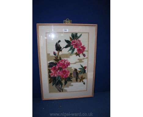 A framed Tapestry of birds on branches of Rhododendrons.