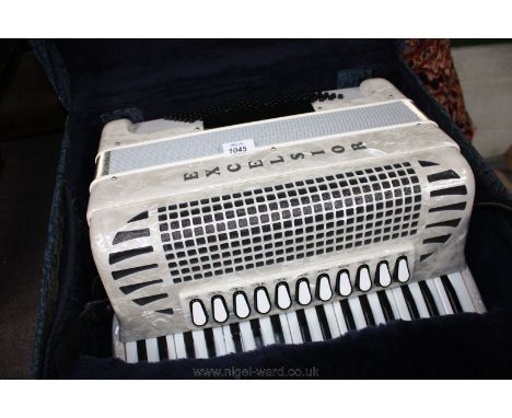A cased blue ''Excelsior'' Accordion, with 96 bass buttons and 37 treble keys, in blue carrying case, in very good condition 