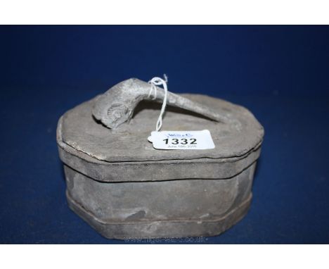 An unusual Lead Tobacco Box of octagonal shape having a lid featuring a handle in the design of a clay pipe, 5 1/2'' x 3 5/8'