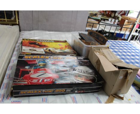 A Tyco Dare Devil Road Racing set; a Scalextric 400 set and two boxes of various Scalextric 