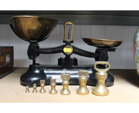 A set of scales and a collection of brass bell weights