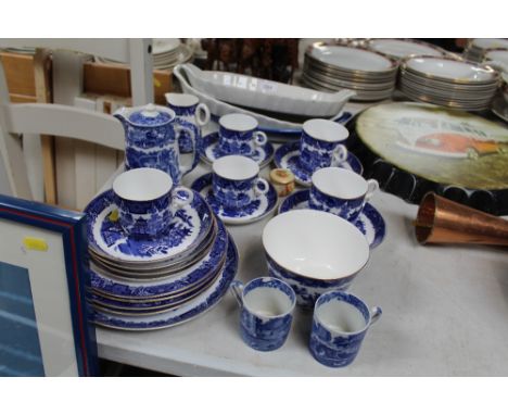 A collection of Royal Worcester blue and white "Willow" patterned teaware; Royal Worcester pot and cover; serving dishes etc
