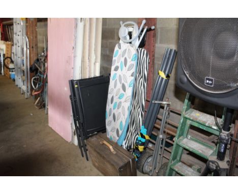 A rotary washing line, three ironing boards and a wooden case