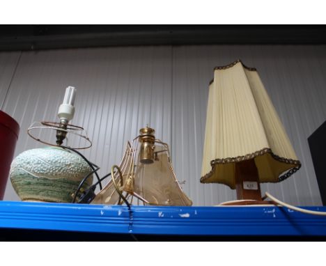 A wooden table lamp, pottery table lamp and light fitting