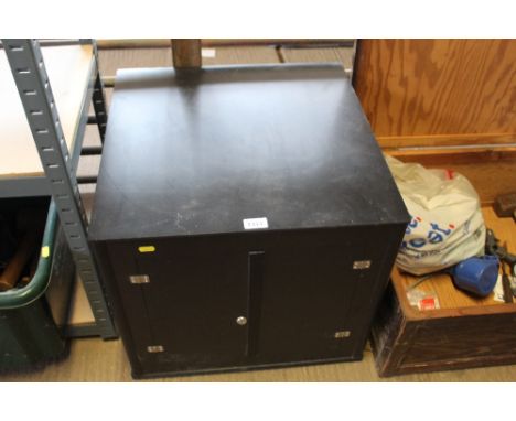 A cupboard on rotary base (locked)