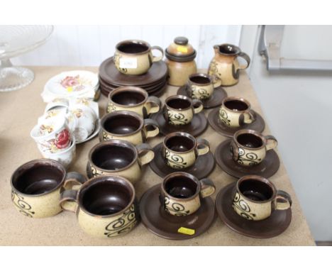 A collection of pottery teaware; a collection of coffee cans and saucers 