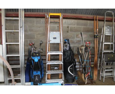 A wooden extending ladder and an aluminium step ladder