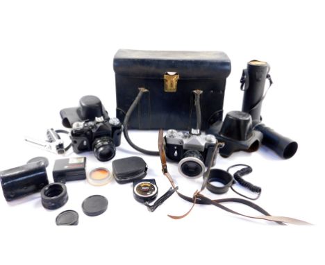 A Zenit-E camera, No 77284253, Zenit-B camera, Prinzgalaxy zoom lens, 1:4.5F=200mm, No 67495, and sundry camera accessories, 