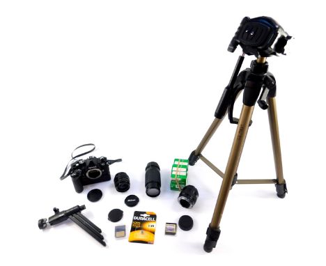 A Nikon FM2 camera, with an MD - 11 motor drive, zoom and other lenses, and a Hama camera tripod. (qty)