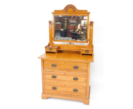 A Victorian satin walnut dressing chest, the swing frame mirror with floral carved crest rail, inset rectangular bevelled gla