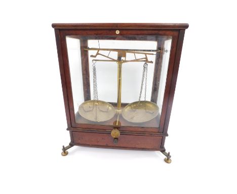 A set of 19thC balance scales by G Wolters, London, brass framed, glazed mahogany case, No.2, with frieze drawer opening to r