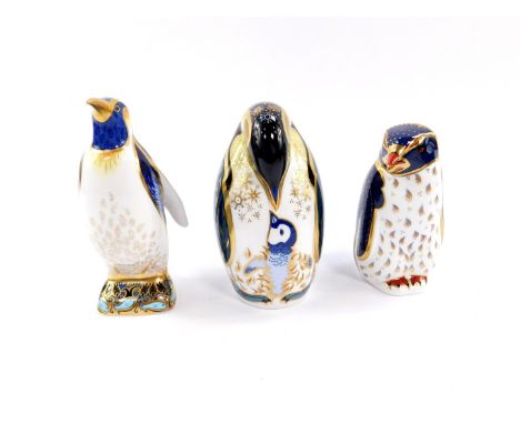 A Royal Crown Derby imari paperweight, modelled as an Emperor penguin, further paperweight modelled as a penguin and chick, b