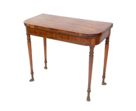 A Regency rosewood and yew wood cross banded demi-lune fold over card table, raised on turned legs, on brass paw feet, 76.5cm